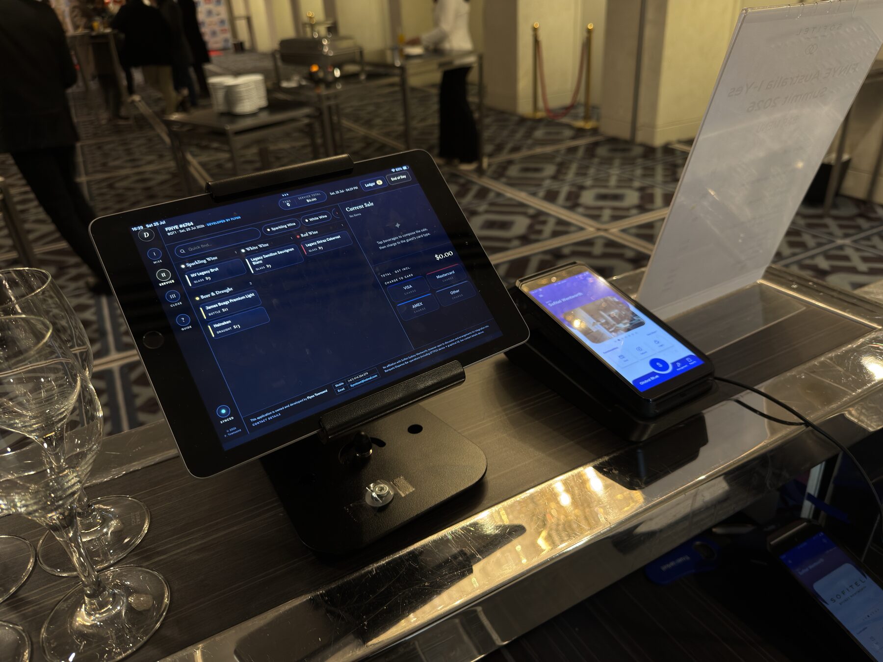 Dispense open on the service screen at a banquet bar, EFTPOS terminal alongside