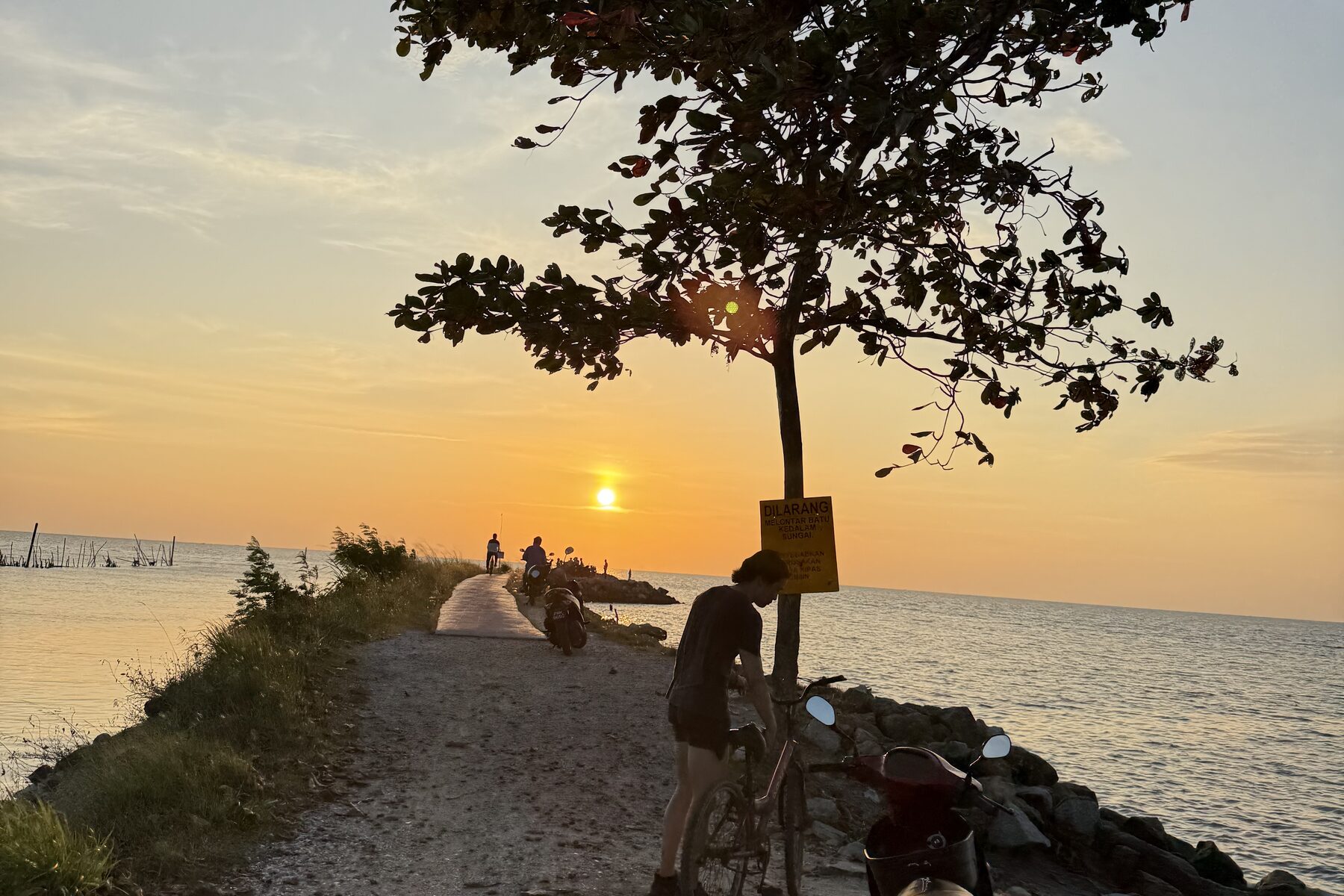 Sunset over the water from a causeway outside Penang